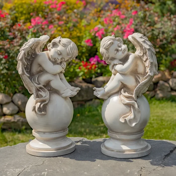 Set of Two 21″ Tall Magnesium Cherubs Sitting on Globe Pedestals “Yael & Cael”